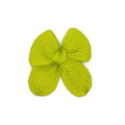 A bright, neon green knitted mohair bow on a white background